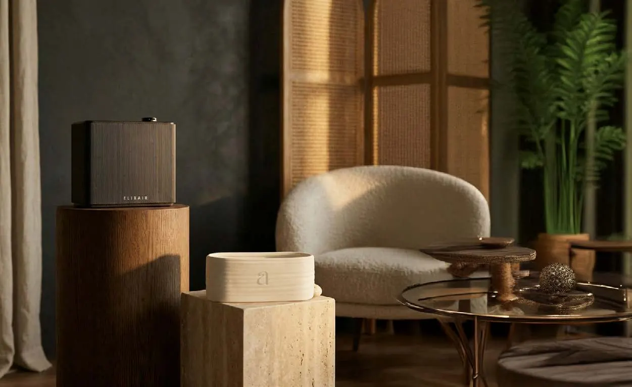 A dark Elix Air machine on a turned oak plinth in a warm, sunlit lounge